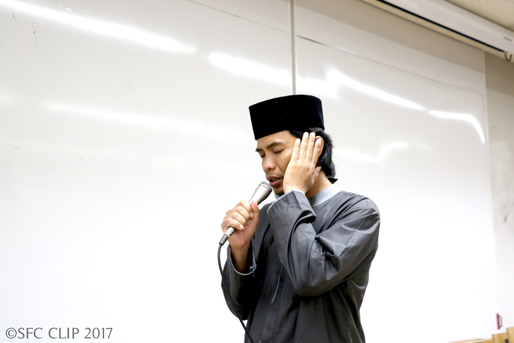 Muriadi Arip, a second-year doctoral student from Indonesia, performs the prayer call (Adhan)